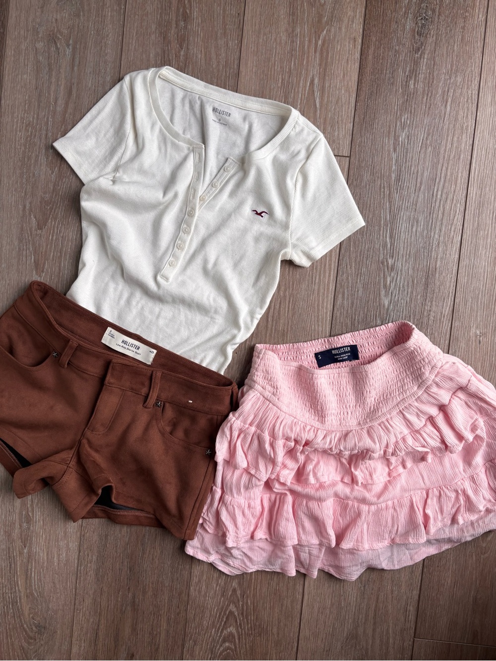 Hollister White Henley Top with Pink Ruffle Skirt and Brown Shorts